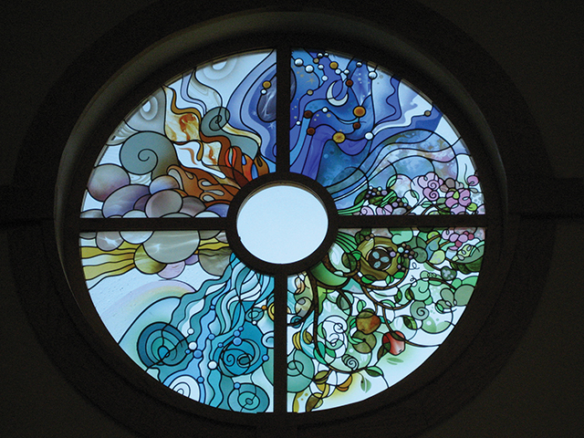 Vision 2016 Tomshack-sisters of St Francis Contemplate the cross stained glass of Sisters of St. Francis