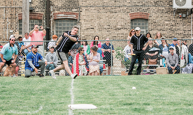 Brother Nathaniel Pierce, S.J.C. takes part in a wiffle ball game: his community members versus a team from the local police precinct.