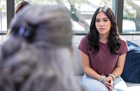 Young woman talking with a counselor