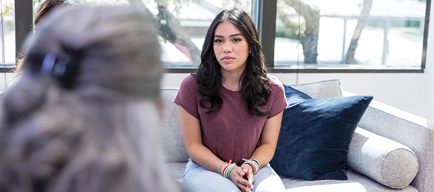 Young woman talking with a counselor