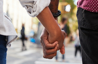 Young couple holding hands